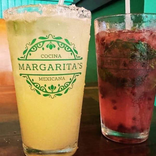Two drinks, a Margarita's Cocina Mexicana branded margarita and a red berry mojito.
