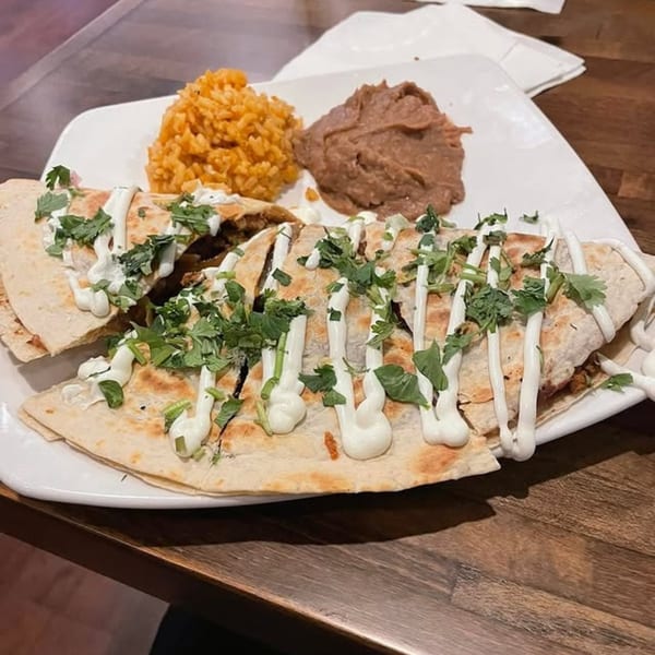 Margarita's Cocina Mexicana's quesadilla with rice and refried beans, drizzled with sour cream and cilantro.